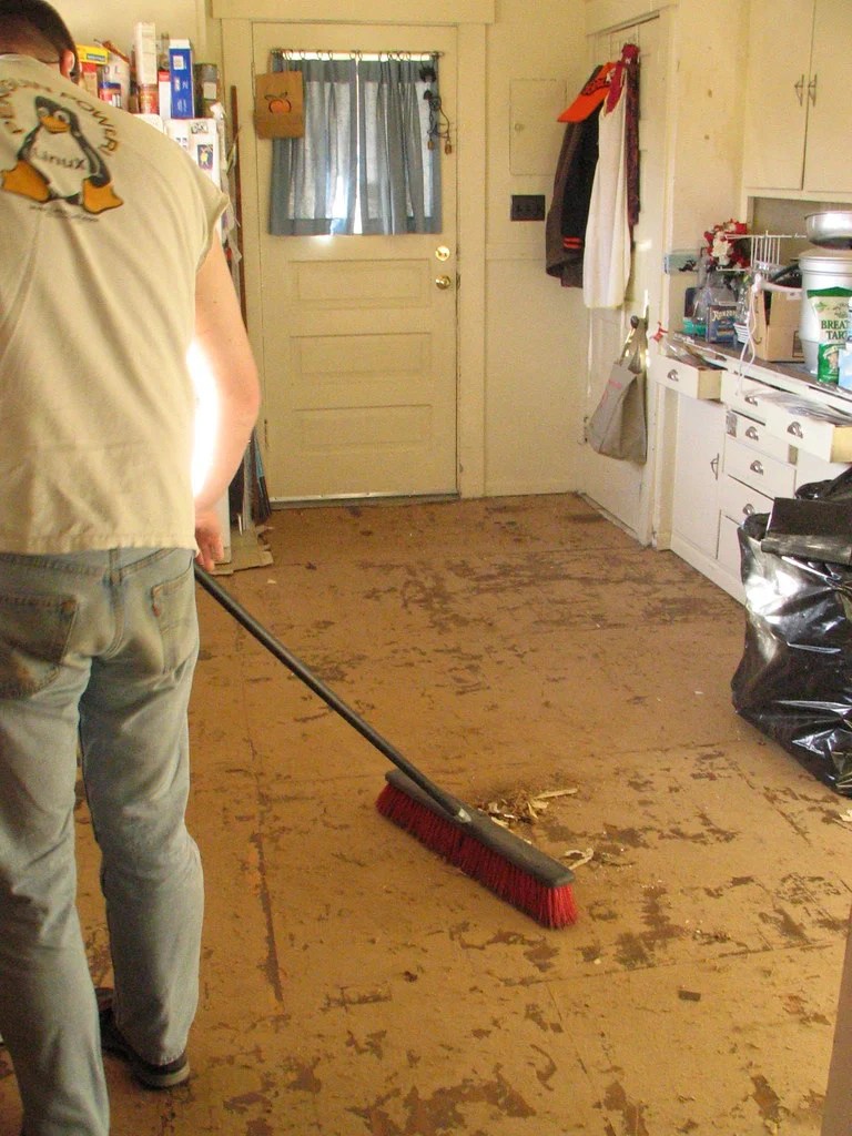 Finishing cleaning up a floor with a broom after a disaster

Photo from litlnemo on flickr creative-commons